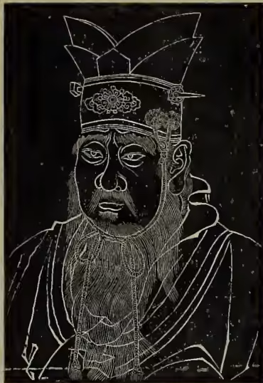 A black and white woodcut-style portrait of Confucius. He is depicted from the chest up, wearing a traditional Chinese official's hat with a prominent, ornate top and a long, flowing beard. He has a serious expression and is looking slightly to the left of the viewer. The style is characteristic of a rubbing from an ancient stone tablet.