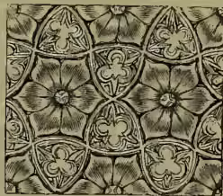 A decorative pattern known as diapering, featuring a repeating geometric design of interlocking floral and leaf motifs within a grid-like structure.