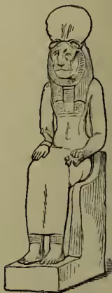 A black and white line drawing of the Egyptian goddess Sekhet. She is depicted in a seated position, wearing a tall, ornate headdress and a long, pleated dress. Her head is adorned with a lion's head, which is a traditional symbol of her. She is holding a small object in her hands, possibly a scepter or a small vessel. The drawing is detailed, showing the texture of her clothing and the features of the lion's head.