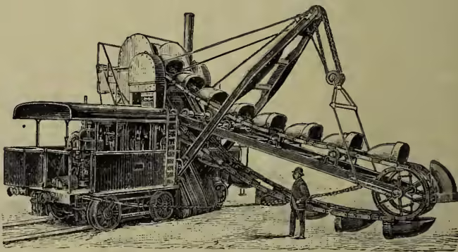 An engraving of a steam excavator, a large machine with a long horizontal arm and a bucket at the end, mounted on a rail system. A man stands near the machine for scale.