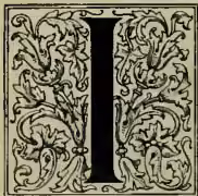A large, ornate decorative initial letter 'I' in black, surrounded by intricate floral and scrollwork patterns in gold and blue.