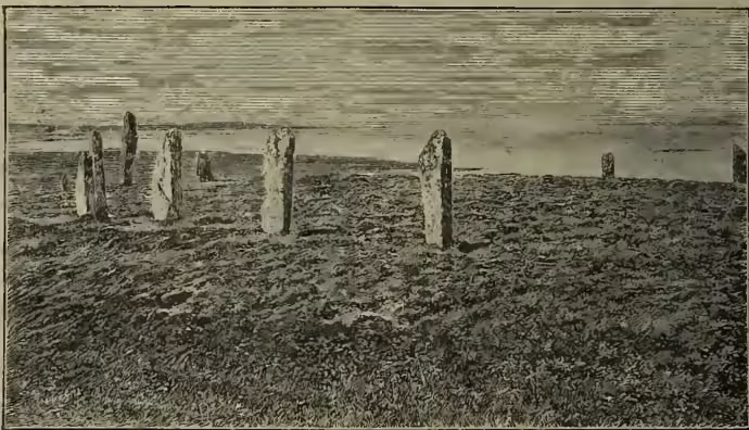 A black and white photograph showing a Stone Circle in Stennis, Orkney, with several standing stones arranged in a circle.